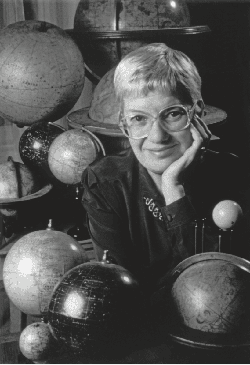 Vera Rubin surrounded by terrestrial table globe in different sizes